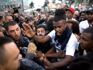 Ethiopian-Israelis and Israeli police scuffle in Tel Aviv last year (AFP/File)