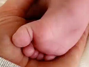 Too cute: Kylie Jenner, 20, doted on her baby daughter Stormi in a Snapchat clip posted Sunday, in which she played with her infant daughter's feet (Source: Kylie Jenner - Snapchat)