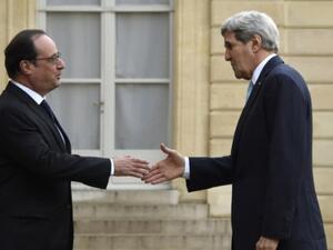 French President Francois Hollande, left, greets US Secretary of State John Kerry. (AFP/File)