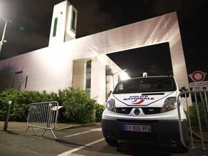 A police vehicle is stationed outside a mosque Thursday in the Paris suburb of Creteil after a man tried to drive a car into a crowd front of the Islamic religious facility. (AFP)