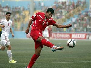 Sameh Maraaba, Palestinian forward, kicks the ball during the Palestinian national team's 2018 FIFA World Cup qualifying match against the UAE on September 8, 2015 in the West Bank.  (AFP/Thomas Coex)