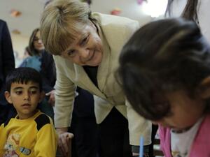 German Chancellor Angela Merkel talks with refugee children at a preschool, during a visit to a refugee camp on April 23, 2016 on the Turkish-Syrian border in Gaziantep. (AFP/Stringer)