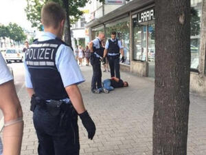 Police are seen arresting the man who began attacking people with a machete in the small town of Reutlingen in southwest Germany. (Twitter)