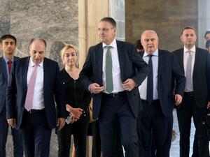 German Secretary of State for Foreign Affairs Markus Ederer (C) walks with Istanbul's deputy Mustafa Yeneroglu of Turkey's ruling Justice and Development Party (AKP) as they visit the damaged Turkish Grand National Assembly in Ankara, on August 8, 2016 following a failed military coup on July 15. (AFP/Adem Altan)