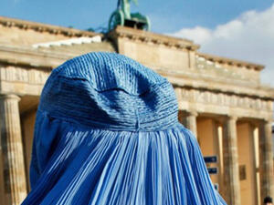 A woman wearing a burka during a demonstration against the German Bundeswehr army's deployment in Afghanistan in front of the Brandenburg Gate in Berlin on February 20, 2010. (AFP/David Gannon)