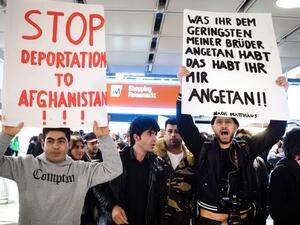 People take part in a demonstration against the deportation of some 50 Afghan refugees from Munich airport, southern Germany, on February 22, 2017. (AFP/Matthias Balk)