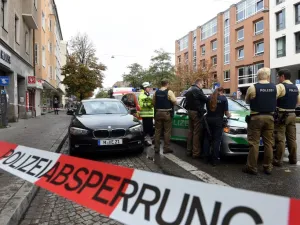 German police stands inside a security perimeter set after a man attacked passersby near Rosenheimer square in the southern German city of Munich on October 21, 2017 (Christof Stache/AFP)
