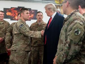 US President Donald Trump greets members of the US military during an unannounced trip to Al Asad Air Base in Iraq. (AFP/ File Photo)