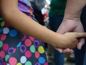 Holding hands: Mohamed Bzeek seeks to help terminally-sick children in the U.S. (AFP / File Photo)