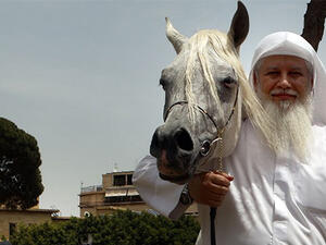 A competitor poses with his horse during a show of Arab horses at the Beirut Hippodrome. (AFP/File)