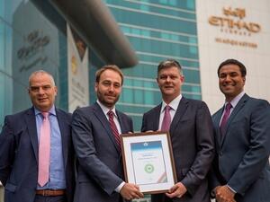 Michael Herero, IATA Area Manager Gulf, second left, presenting the certificate to Etihad Airways management, from left, Umberto Nicolardi, Head of E-Commerce; Justin Warby, Vice President Digital Transformation and Innovation; and Leslie Varghese, Senior Manager Distribution.