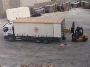The ICRC loads a truck in Damascus, headed for the besieged city of Madaya. (AFP/File)