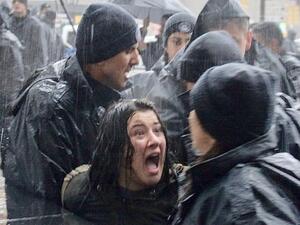 A woman shouts at Turkish riot police as they detain her during a rally  in Ankara (AFP/File Photo)