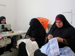 Palestinian women embroider at a workshop in Jerash refugee camp, northern Jordan (AFP Photo)