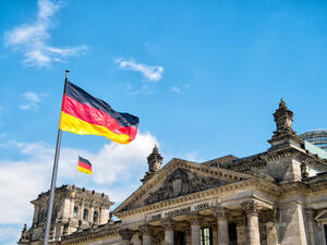 German flags waving in the wind at famous Reichstag building, seat of the German Parliament (Shutterstock/File Photo)