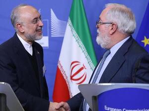 Miguel Arias Canete (R), Commissioner of the European Commission in charge of Climate Action and Energy, and Vice-President of the Islamic Republic of Iran and Head of the Atomic Energy Organisation of Iran (AEOI), Ali Akbar Salehi shake hands during a joint press point in Brussels on November 26, 2018. AFP
