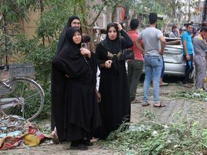 Iraqis react on May 10, 2016 the site of a car bomb explosion which hit the Shifta area in the city of Baquba the previous day, killing at least 10 people. (AFP/Younis al-Bayati)