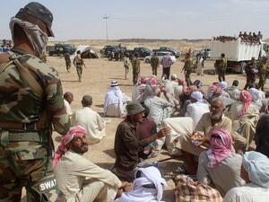 Displaced Iraqis who were evacuated by Iraqi government forces south of the besieged city of Fallujah rest at a safe zone in Subayat during a military operation to retake territory from Daesh on June 12, 2016. (AFP/Moadh al-Dulaimi)