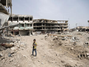 A boy stands in ruins in west Mosul, Iraq. (AFP/file)