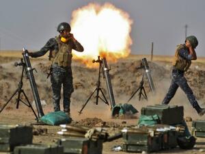 Iraqi soldiers firing mortars. (AFP/File)