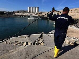An employee works on Mosul dam. (AFP/ File)