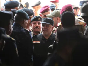 Iraqi Prime Minister Haider Abadi arriving in Mosul to declare victory over ISIS there in July (file photo/AFP)