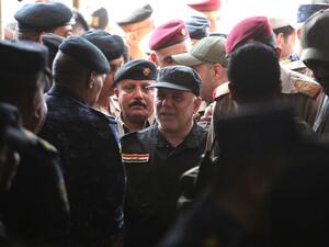 Iraqi Prime Minister Haider Abadi arriving in Mosul to declare victory over ISIS there in July (file photo/AFP)
