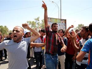 Iraqi protesters shout slogans during a demonstration in the southern city of Basra. (AFP/ File Photo)
