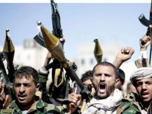 Tribesmen loyal to Houthi rebels hold their weapons in Sana’a. (AFP/ File)