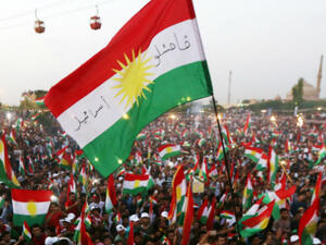 Iraqi Kurds fly Kurdish flags during an event to urge people to vote in the upcoming independence referendum. (AFP/ File)