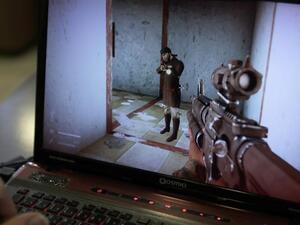 A man plays a computer game created by Hezbollah called "Holy Defence". (AFP/ File Photo)