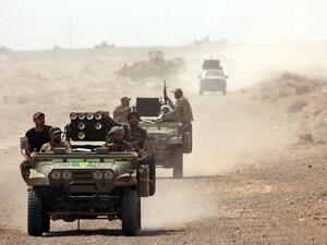 Iraqi army forces drive through the embattled Anbar province. (AFP/File)