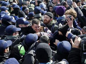 Israeli settlers scuffle with security forces at the Amona outpost on Feb. 1, 2017 as they evict the hardline occupants of the wildcat settlement outpost. (AFP/Jack Guez)