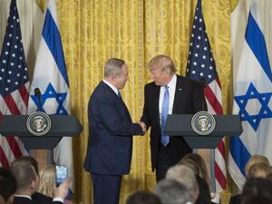 Trump and Netanyahu shake hands at recent press conference [Byline / Source / Credit
Saul Loeb / AFP]