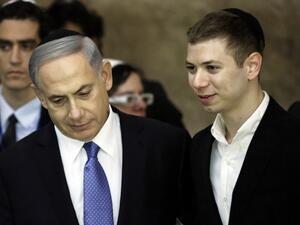 A picture taken on March 18, 2015 shows Israeli Prime Minister Benjamin Netanyahu (L) and his son Yair visiting the Wailing Wall in Jerusalem (Thomas Coex/AFP)
