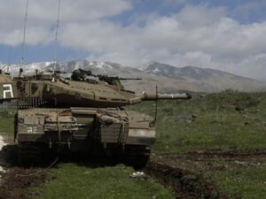 An Israeli tank in the Golan Heights (AFP/Jalaa Marey)