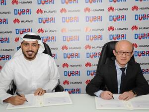 Issam Kazim, CEO, DCTCM and Gene Jiao, President of Huawei CBG, Middle East & Africa at the signing ceremony.
