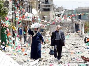 A couple walks through the streets of Jbeil in northern Lebanon. (AFP/File)