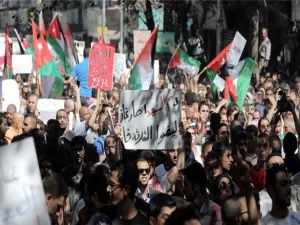 Activists have called for another hour-long blackout on Monday, and for placing the Jordanian flag on buildings.  (AFP/Ahmad Alameen)