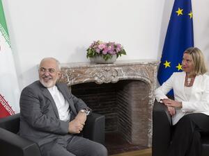 Iranian Foreign Minister Mohammad Javad Zarif (L) meets with European Union Foreign Policy Chief Federica Mogherini, to discuss Iran's nuclear deal/AFP