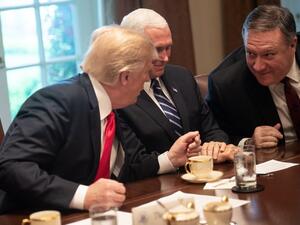 US President Donald Trump speaks (R) with Secretary of State Mike Pompeo as Vice President Mike Pence (C) (AFP/File Photo)	