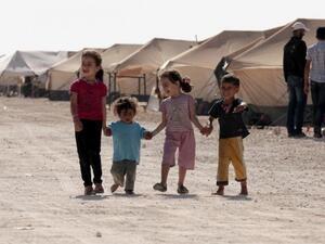 Refugee children walk among tents at the Zaatri refugee camp, near the Jordanian border with Syria. (AFP/ File)