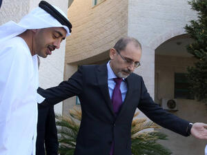 Jordanian Foreign Minister Ayman Safadi (R) greets his Emirati counterpart Sheikh Abdullah bin Zayed Al Nahyan upon the latter's arrival in the capital Amman. (AFP/ File)
