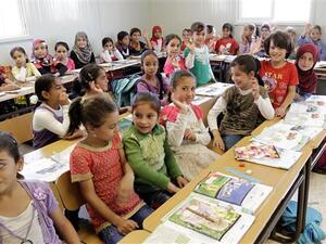 Children sit in a classroom at a UN-run camp for Syrian refugees, northeast of the Jordanian capital Amman, September 22, 2015. (AFP)