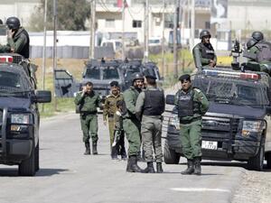 Members of the Jordanian security forces stand guard at a border crossing. (AFP/ File Photo)