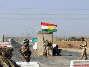 Kurdish forces guard a checkpoint between Kirkuk and Tikrit. Image used for illustrative purposes. (AFP/File)