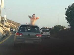 Police in Lebanon are looking for a woman who exposed her breasts from a car on a highway. (Daily Mail)