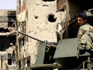 A Lebanese soldier monitors an area in the Abra district of the southern city of Sidon on June 28, 2013. (AFP/Mahmoud Zayyat)