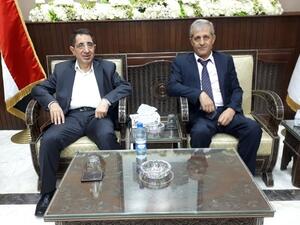 Hezbollah MP and caretaker Industry Minister Hussein Hajj Hasan (L) meets with the Syrian economy and trade minister in Syria on Sept. 6, 2018 (The Daily Star)