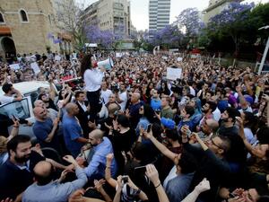 Independent parliamentary candidate Joumana Haddad speaks to members of a civil society movement rallying in front of the Ministry of Interior in Beirut contesting the unofficial results/ AFP